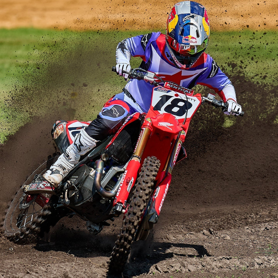 red Motocross bike in purple Alpinestar clothing