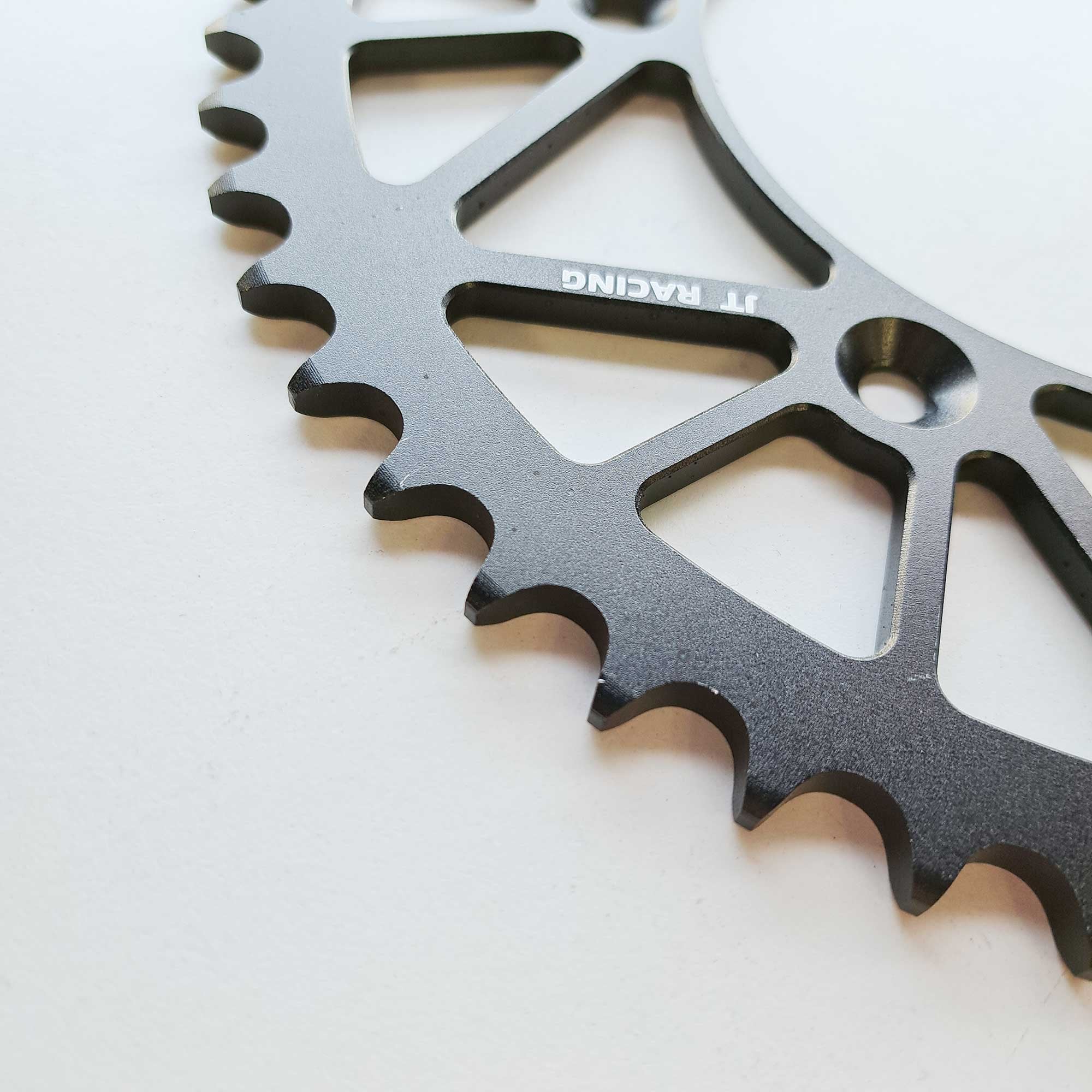 JT - Sprocket - Rear - JTA897/224U/TR130 - 520 - KTM 125-530 90-26, Husqvarna 125-501 14-26, Gas Gas 125-450 21-26, Triumph 250/450 24-26, STARK - Black
