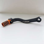 Apico Elite Gear Lever - KTM SX125 98-00, SX250 94-16, SX300 95-96, SX360 96-97, SXF250 05-10, EXC125/200 98-00, EXC250/300 94-16, EXC360 96-97, EXCF250 06-10, Husqvarna TC250 14-16, TE250/300 14-16, Husaberg TE250/300 11-14 (Black/Orange)