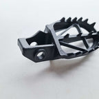DRC - Foot Pegs (Ultra-Wide) - KTM SX85 18-24, SX125/150 16-22, SX250 17-22, SXF250-450 16-22, EXC/EXCF250-500 17-23, Husqvarna TC85 18-24 TC125 16-22, TC250 17-22, FC250-450 16-22, TE/FE 150-501 17-23, Gas Gas MC/MCF/EC/ECF/EX/EXF 85-450 21-23