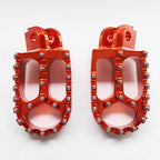 Apico - Foot Pegs - XTREME - KTM SX50 14-23, SX65 11–23, SX85 03-17, SX125/150 98-15, SX250 00-16, SXF250-450 06-15, EXC/EXCF 98-16, Husqvarna TC50/65 17-23, TC85 14-17, TC/FC 125-450 14-15, TC250 14-16, TE/FE 14-16, Gas Gas MC50/65 21-23 - Orange
