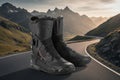 Pair of black motorcycle boots with brand logo on a white background
