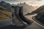 Pair of black motorcycle boots with brand logo on a white background