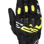 Black motorcycle glove with yellow accents on a white background