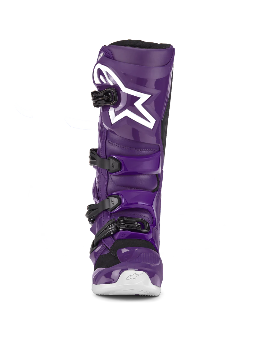 Purple motocross boot with a white star logo on a white background