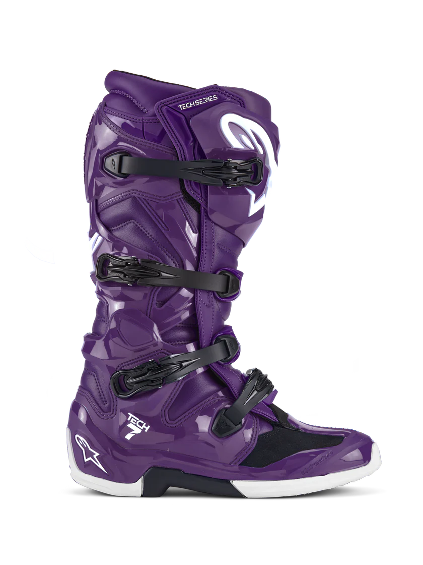 Purple motocross boot with black straps on a white background