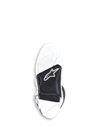 White and black motocross boot on a white background