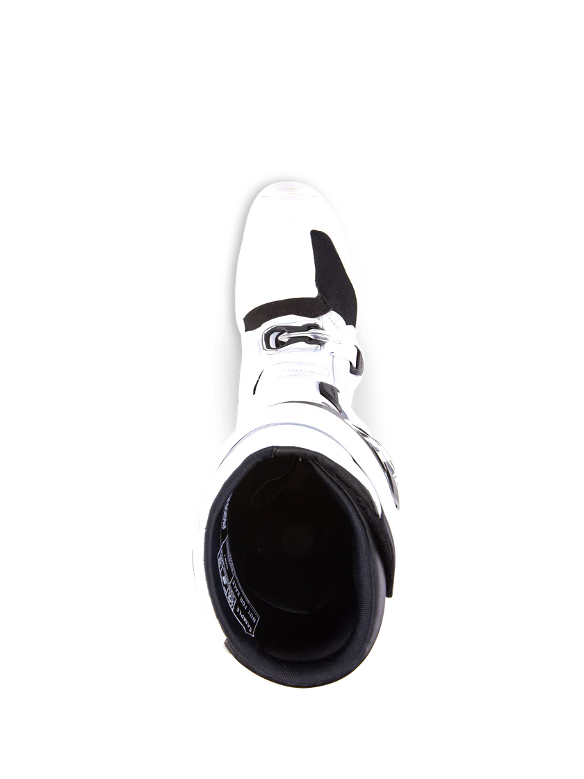 White motocross boot with black sole on a white background